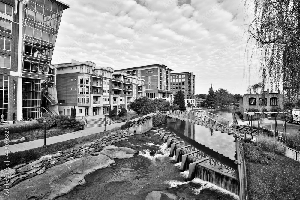 Black and white picture of downtown buildings, apartments, river, and trees