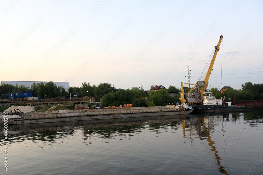 View of barge with crane on Oka river