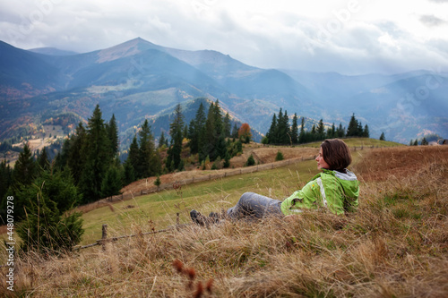 Hiker woman in moumtains in autumn photo