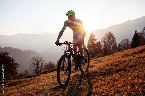 Cyclist in the autumn mountain