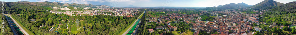 Reggia di Caserta, Italy. Aerial view of famous royal building gardens from a drone in summer season.