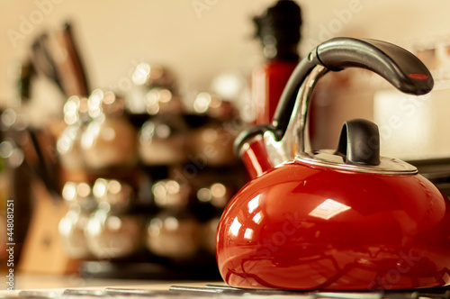 Red kettle in a kitchen