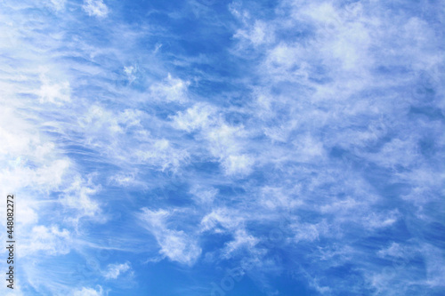 Beautiful blue sky and white cirrocumulus clouds. Spindrift clouds. Background. Texture. Scenery. photo