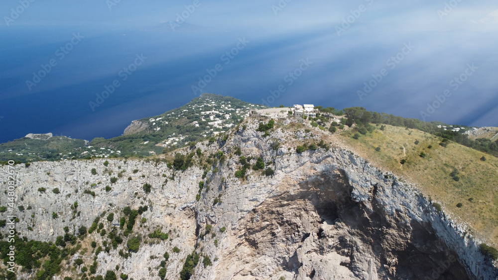 Capri coastline from a high flying drone over Mt Solaro in summer season.