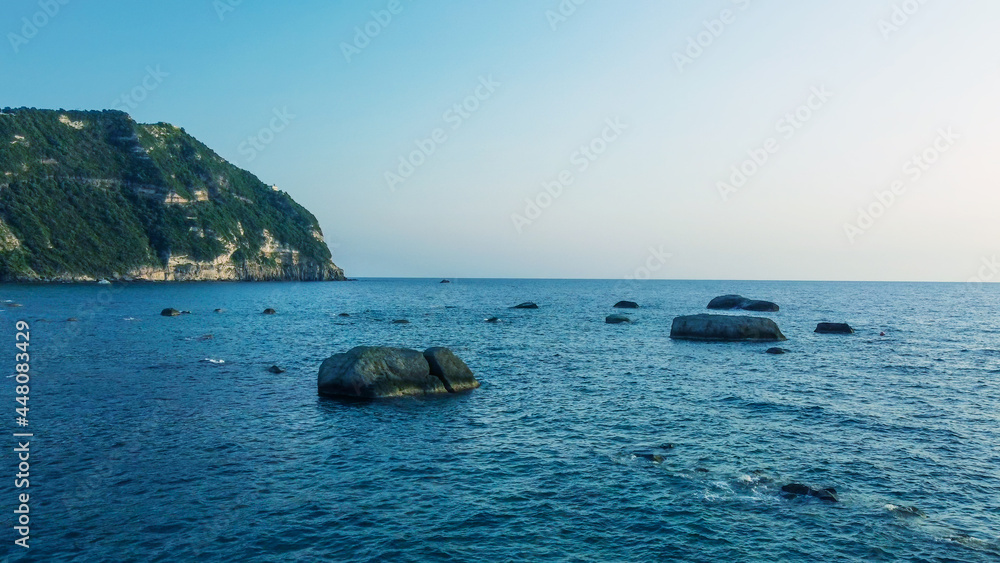 Rocks over the water in Citara, Ischia. View from a drone.