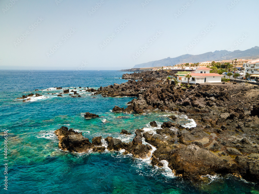 Tenerife, San Juan a town on the Atlantic Ocean. Sunny coast and port city. Ocean, water, waves, blue ocean.