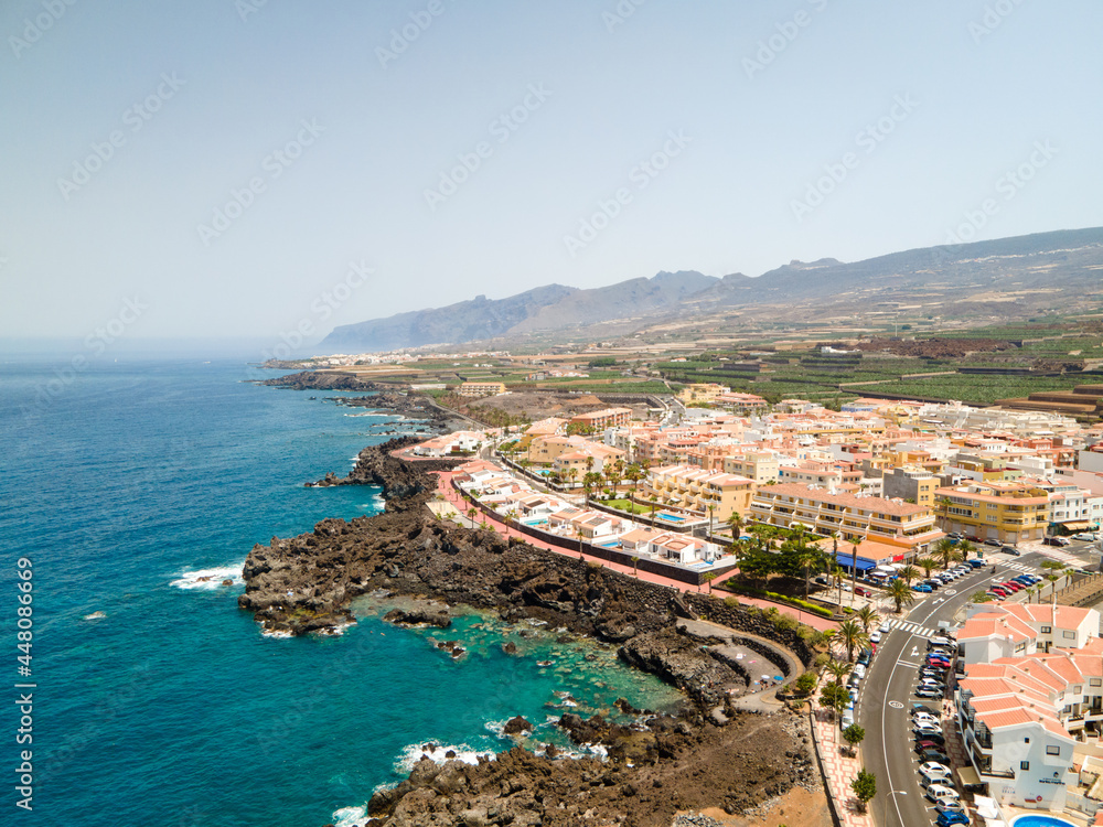 Tenerife, San Juan a town on the Atlantic Ocean. Sunny coast and port city. Ocean, water, waves, blue ocean.
