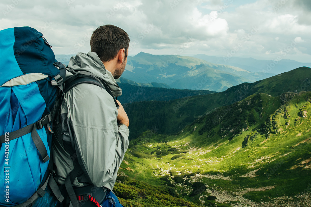 Man in mountains with backpack Man in mountains with backpack