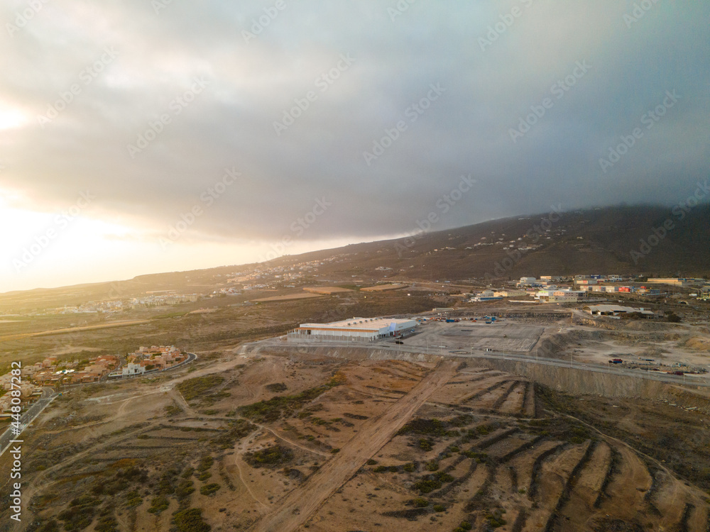 Tenerife, a town on the Atlantic Ocean. Sunny coast and dry soil. Ocean, water, waves, blue ocean.