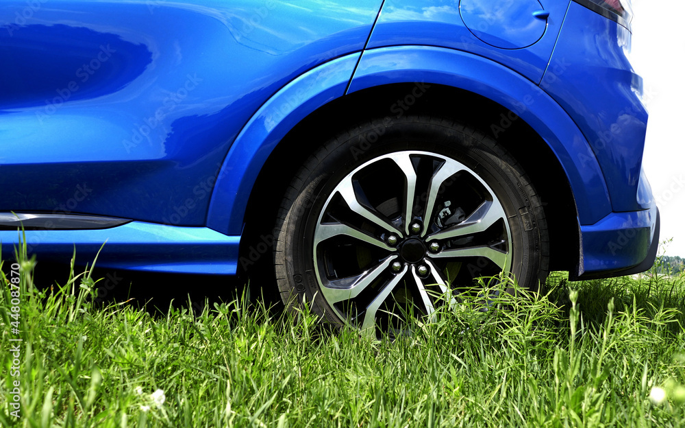 Rear Car Wheel Staying On A Lawn Grass Rear Car Wheel Staying On A Lawn Grass