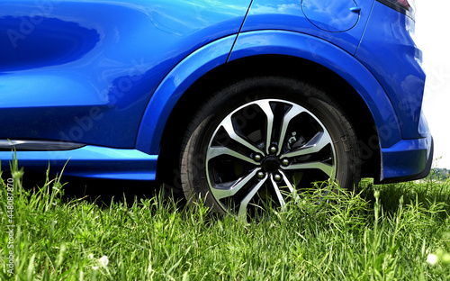 Rear Car Wheel Staying On A Lawn Grass  © AnyVIDStudio