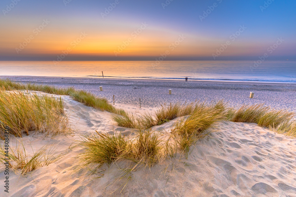 Sunset View over ocean from dune in Zeeland Sunset View over ocean from dune in Zeeland