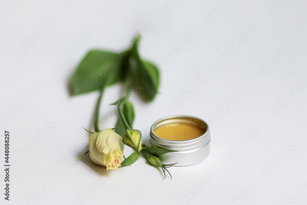 Cream in a jar on a white background Cream in a jar on a white background