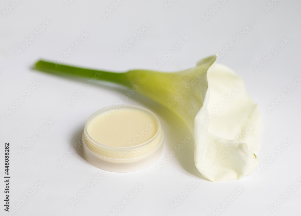 Cream in a jar on a white background Cream in a jar on a white background