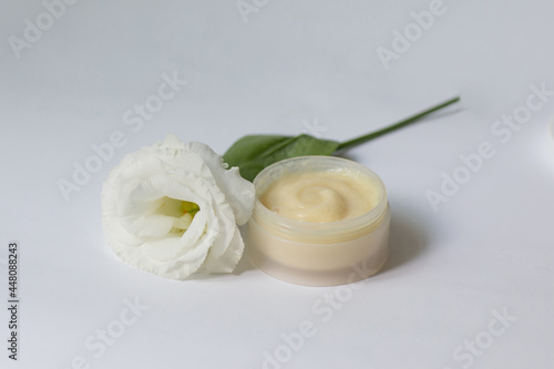 Cream in a jar on a white background