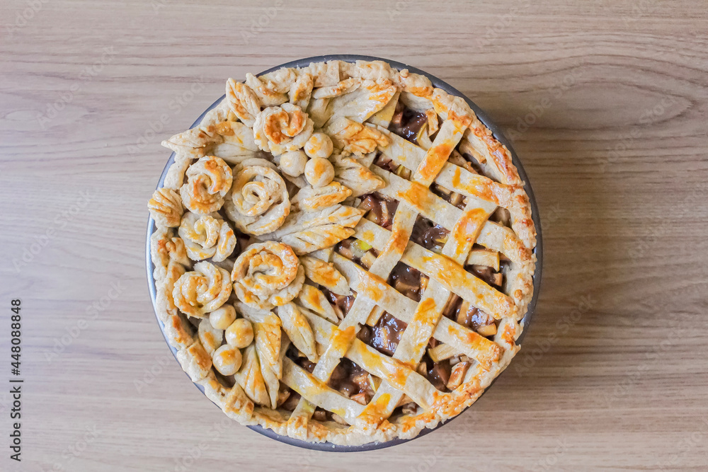 Autumn composition. Decorated apple pie on a table with flour and linen fabric. Blog, blogger and social media. Autumn composition. Decorated apple pie on a table with flour and linen fabric. Blog, blogger and social media.