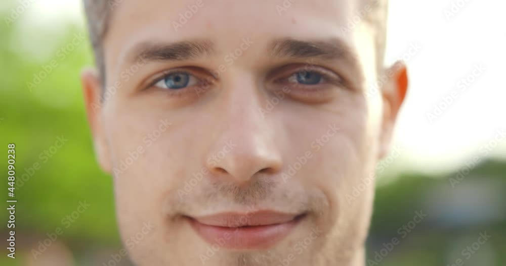 Close up face portrait of smiling caucasian man outdoors. Bokeh shot Close up face portrait of smiling caucasian man outdoors. Bokeh shot