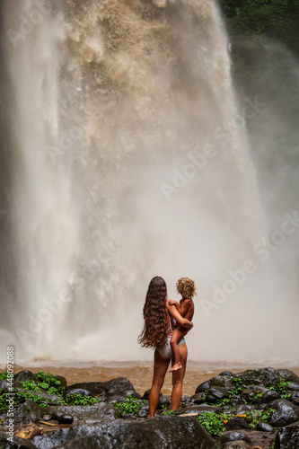 Mom and son near a waterfall in Bali