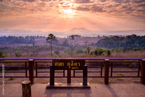 Sunrise behind mountain view at Sala Dusita sunrise viewpoint, Thung Salaeng Luang national park, Thailand: TEXT TRANSLATION: Dusita Viewpoint photo