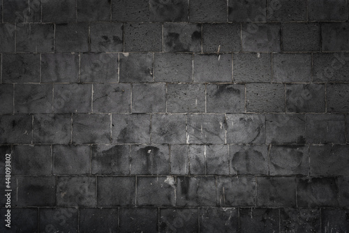 dark gray bricks on the wall decoration for background.