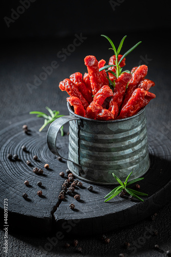 Spicy kabanos seasoned with herbs. Tasty aromatic sausages. photo