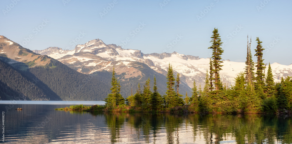 View of Canadian Nature Landscape with rocky islands and mountains in the background. Garibaldi Lake, Near Whistler and Squamish, North of Vancouver, British Columbia, Canada. Sunny Summer
