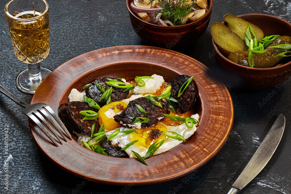 Fried eggs with blood sausages, pickles, mushrooms and liqueur Fried eggs with blood sausages, pickles, mushrooms and liqueur