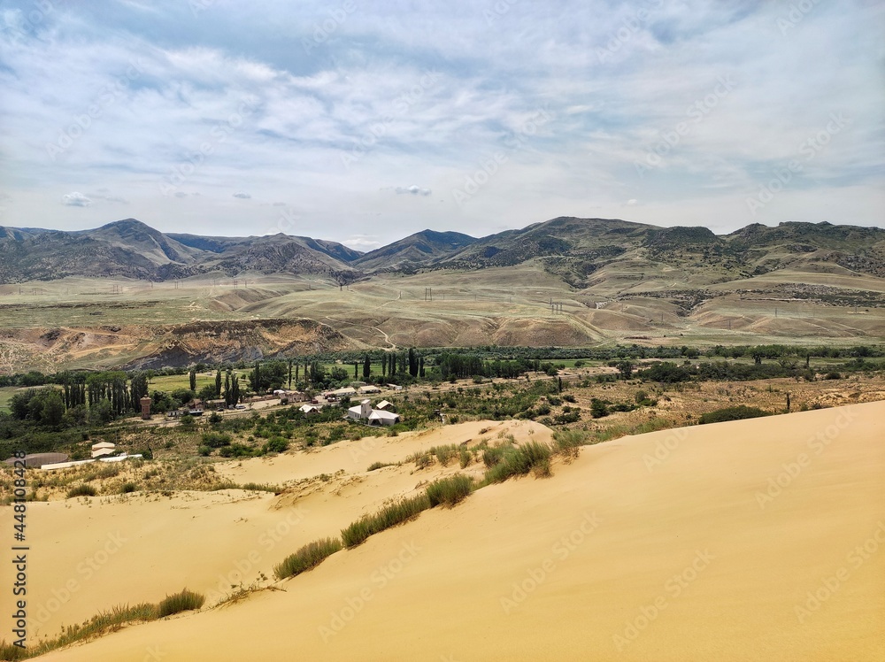 Dune of Sary-kum and mountains in Dagestan, Russia
