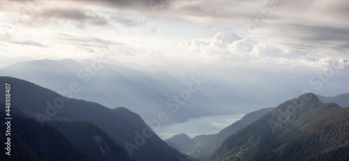 Aerial View from Airplane of a Valley in Canadian Mountain Landscape. Dramatic Sunny Sunset. Howe Sound between Squamish and Vancouver, British Columbia, Canada.