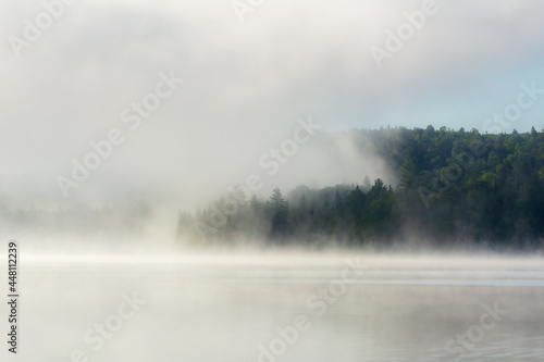 Mist on a great lake in Quebec, Canada in the morning