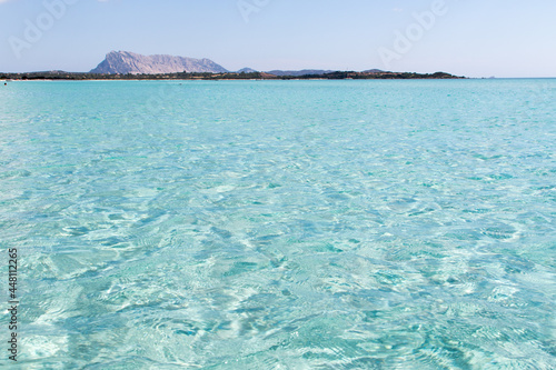 July 23, 2021: Transparent and crystal clear water near La Cinta beach in Sardinia, Italy