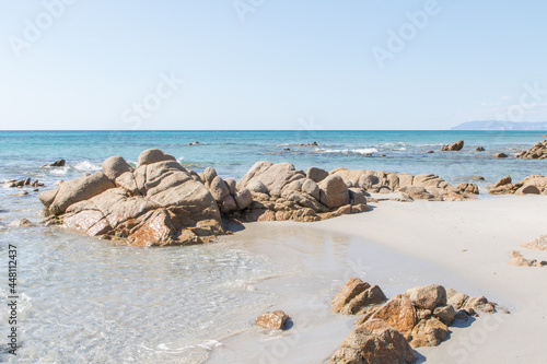 July 23, 2021: crystal clear sea near the beach of granite rocks of Biderosa, Sardinia.