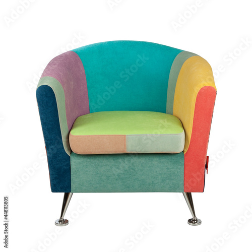 Compact armchair upholstered in colorful multicolored patchwork fabric, isolated on white background. Front view.