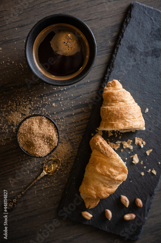 croissant with coffee dark background. High quality photo