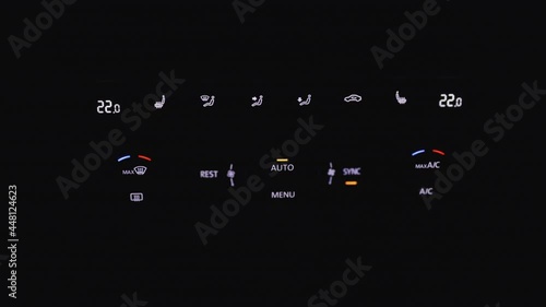 Detail of buttons of Climate control and car ventilation. Car air conditioning system grid panel on console. Air conditioner button in the car. Dual climate control in the car photo