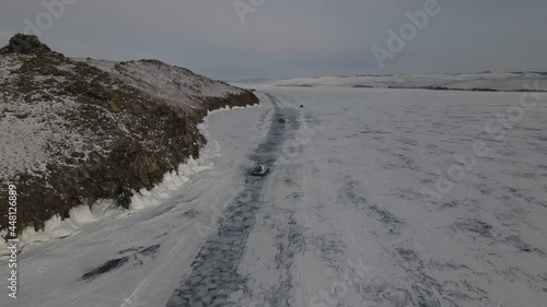 khivus on a hovercraft rides on the frozen lake Baikal, a trip to Russia. High quality 4k footage photo