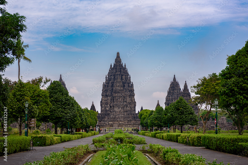 Prambanan temple front view with green garden and walking path Prambanan temple front view with green garden and walking path