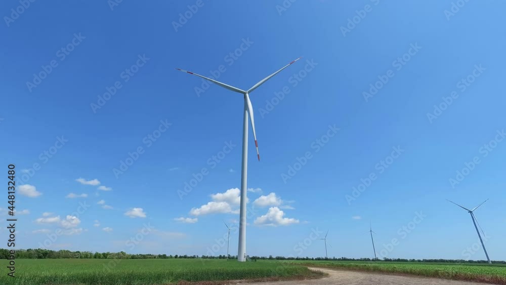 Electric windmill with long blades close-up. Wind turbine for the production of electricity. Electric windmill with long blades close-up. Wind turbine for the production of electricity.