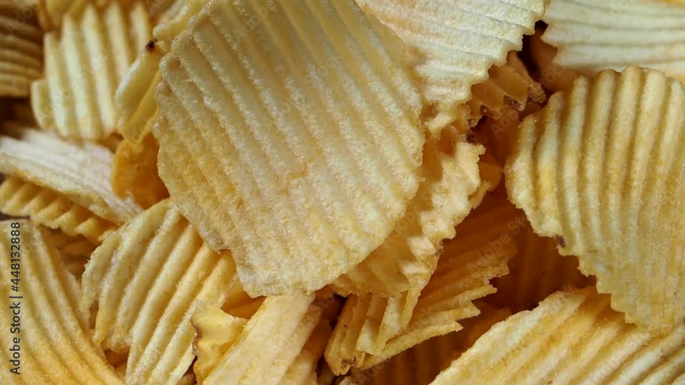 Savory potato chips on a rotating plate Savory potato chips on a rotating plate