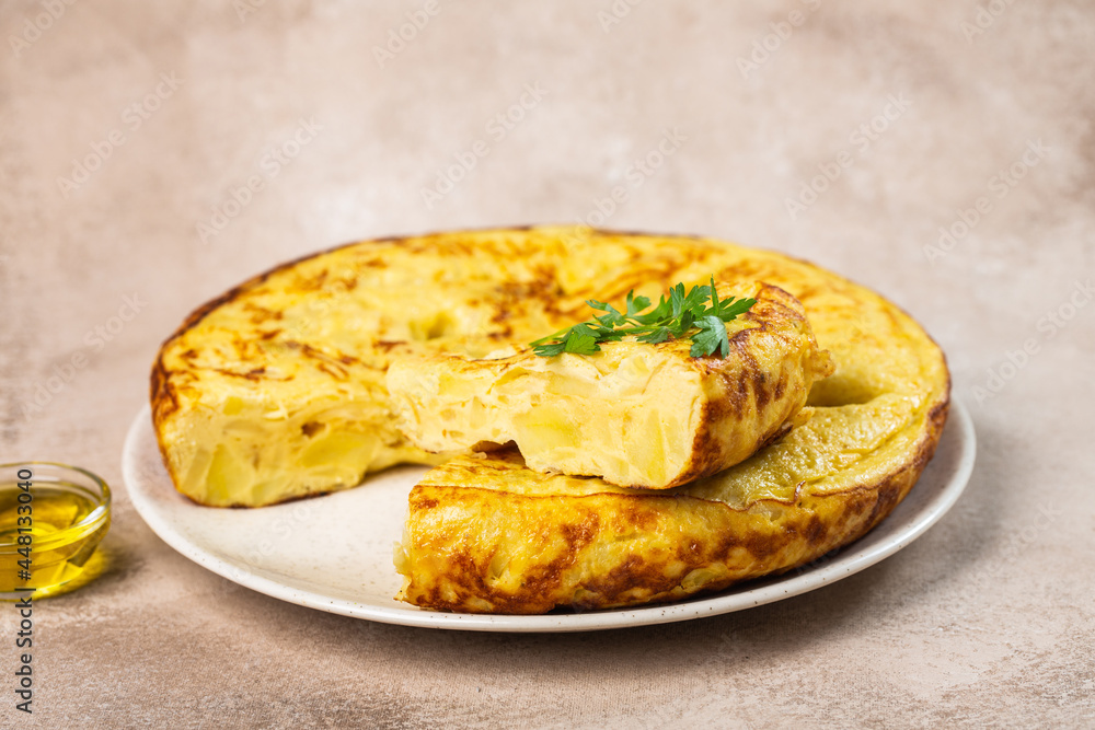 Traditional spanish omelette with eggs on a table
