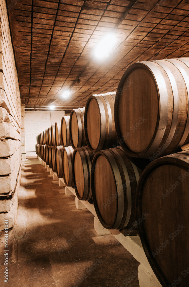 Wooden wine barrels in the basement