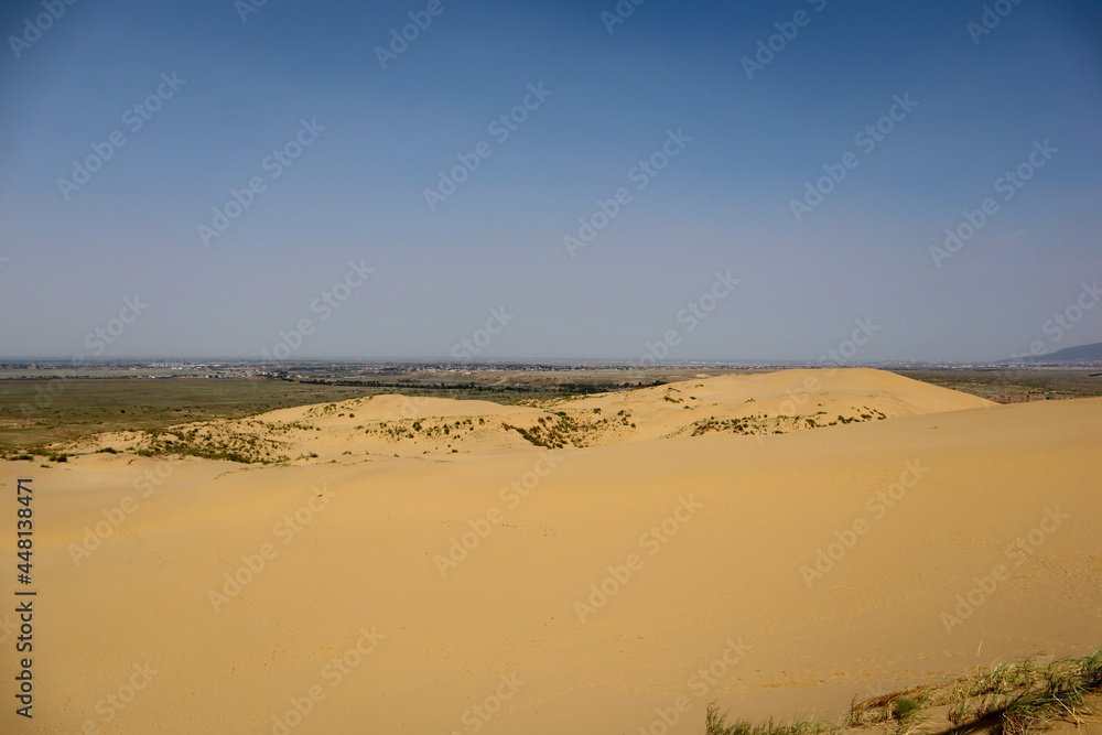 scenic view to sand dune Sarykum in Dagestan and Caspian sea