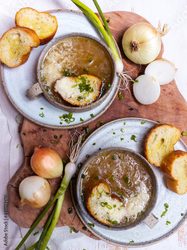French cuisine onion soup in a ceramic cup with croutons