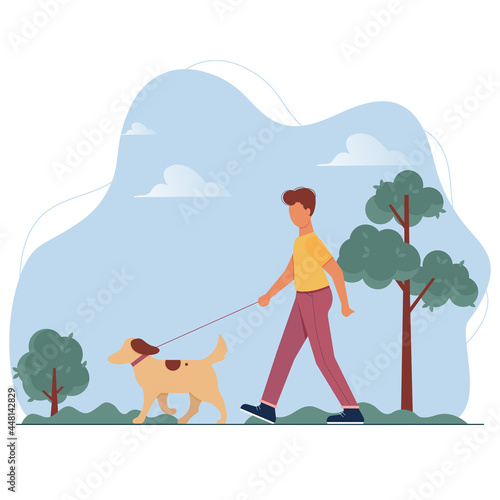 Young man with dog on leash walking in public city park. Boy spending time with pet in forest. Promenade with animal among trees.