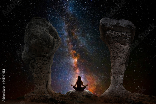 Woman meditating with yoga between dolmens photo