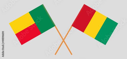 Crossed flags of Benin and Guinea. Official colors. Correct proportion
