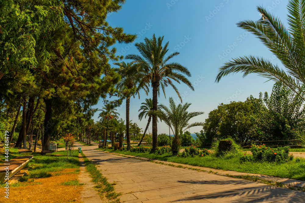 ANTALYA, TURKEY: Picturesque Karaalioglu park with palm trees on a sunny day in Antalya. ANTALYA, TURKEY: Picturesque Karaalioglu park with palm trees on a sunny day in Antalya.