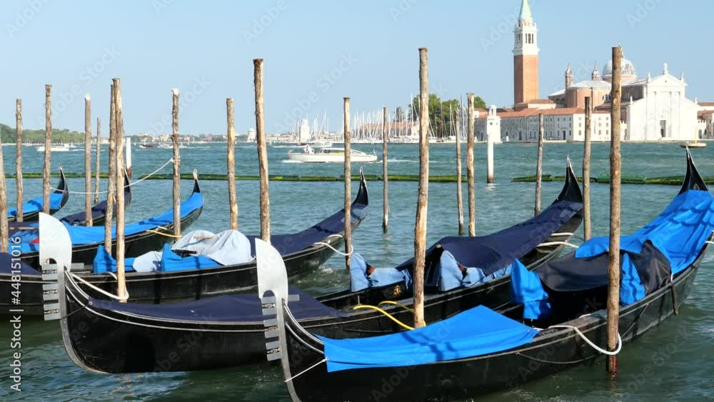 Venice, Italy - gondolas and gondoliers in the Grand Canal near the Rialto Bridge, in the San Marco Basin and between the canals of the lagoon city Venice, Italy - gondolas and gondoliers in the Grand Canal near the Rialto Bridge, in the San Marco Basin and between the canals of the lagoon city