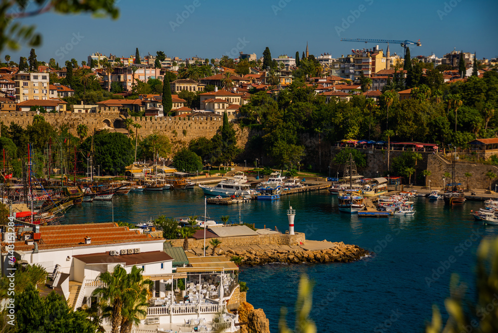 ANTALYA, TURKEY: Top view of the old harbor and the pier for tourist boats and pirate ships in the port in Antalya.