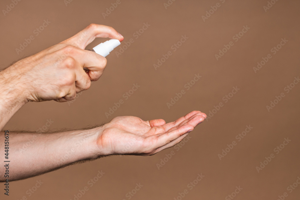Hand wash. Man hands using wash hand sanitizer gel pump dispenser for protection coronavirus and bacteria, health care concept. Close-up. Hand wash. Man hands using wash hand sanitizer gel pump dispenser for protection coronavirus and bacteria, health care concept. Close-up.